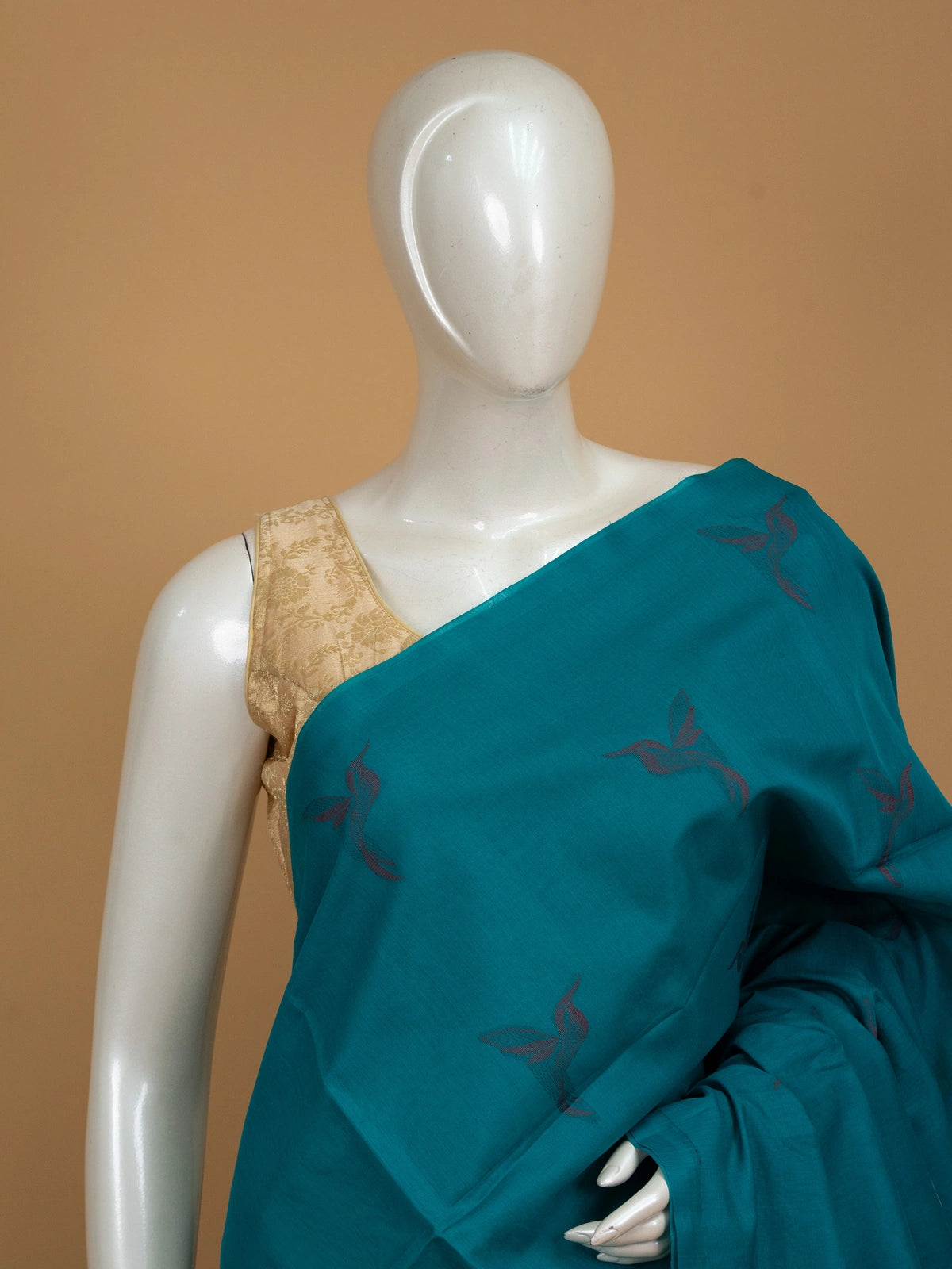 Teal blue pure silk cotton saree with woven bird motifs and contrast red pallu and border
