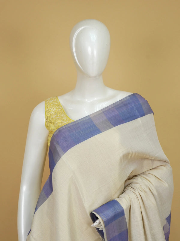 Cream linen cotton saree with blue and purple checked contrast pallu and border
