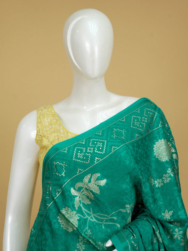 Sea green designer saree with tonal floral weave, lotus pallu motifs and patola-style border