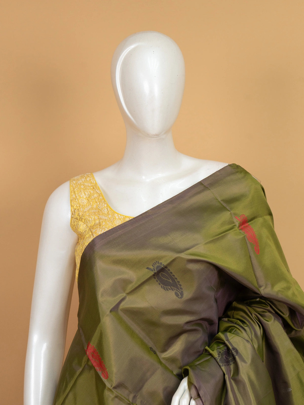 Olive green banana silk saree with contrast pink pallu, gold zari stripes and woven paisley buttas