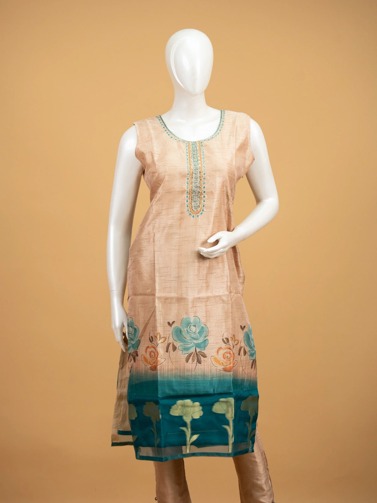 Beige floral raw silk straight cut kurti set with mirror work neckline, teal border and matching dupatta