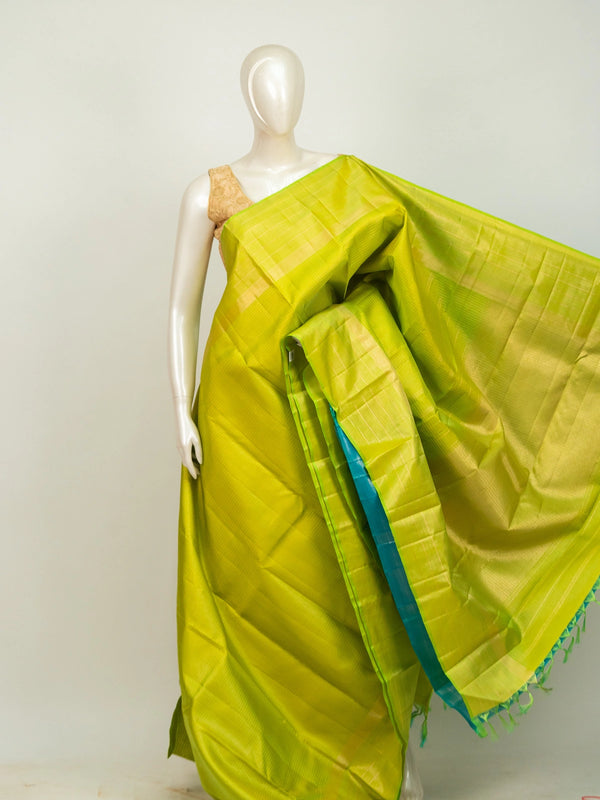 Parrot green Pure Kanchipuram silk saree with gold zari checks, gold zari border and contrasting teal pallu