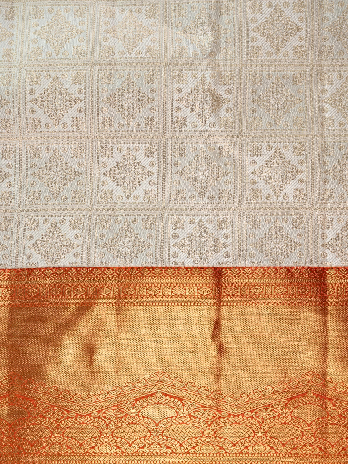 Cream Pure Kanchipuram silk saree with gold zari checkerboard body and contrast orange zari border