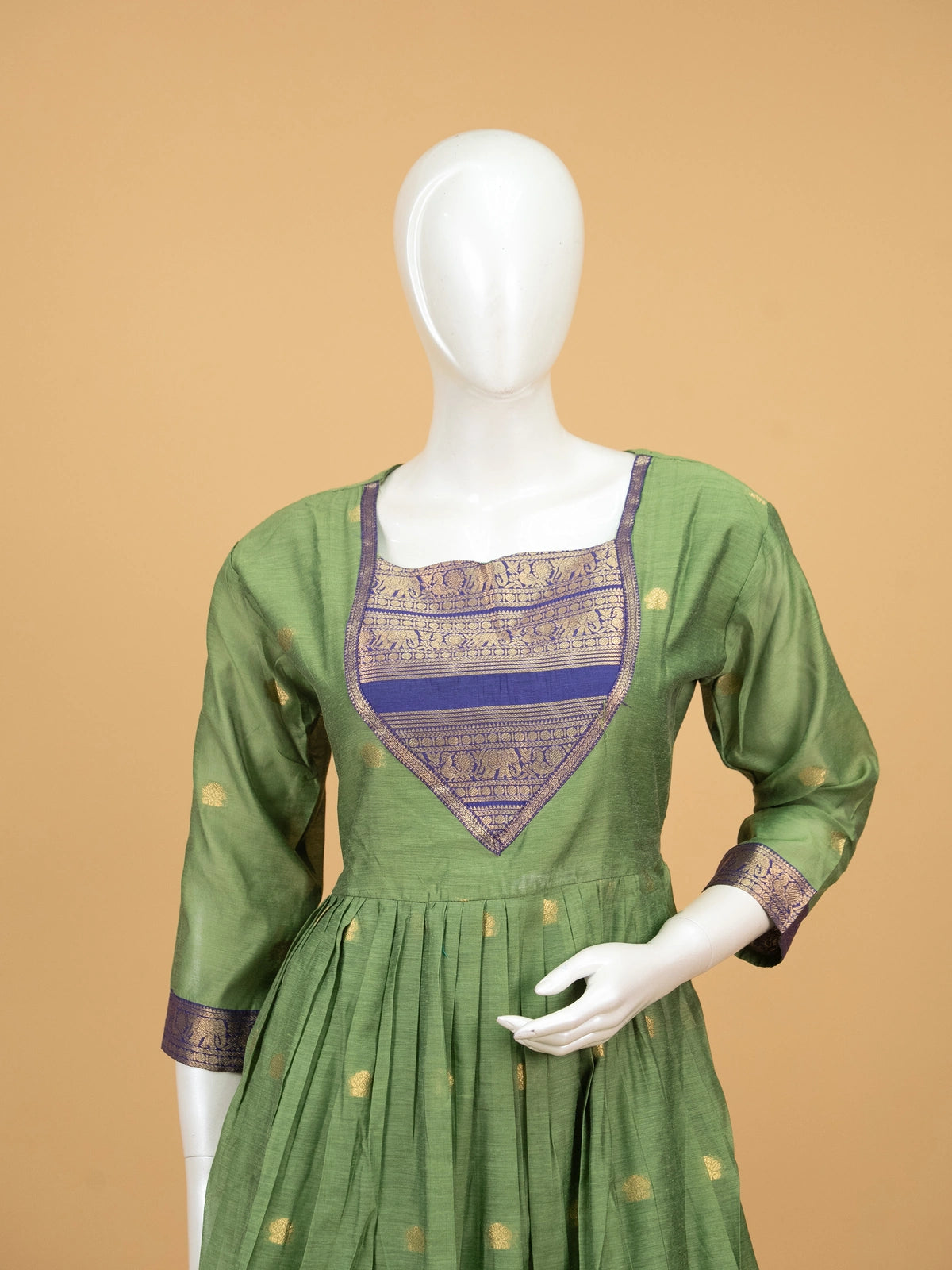 Green cotton silk Anarkali kurti set with navy zari woven yoke, elephant-motif border, and contrast navy dupatta