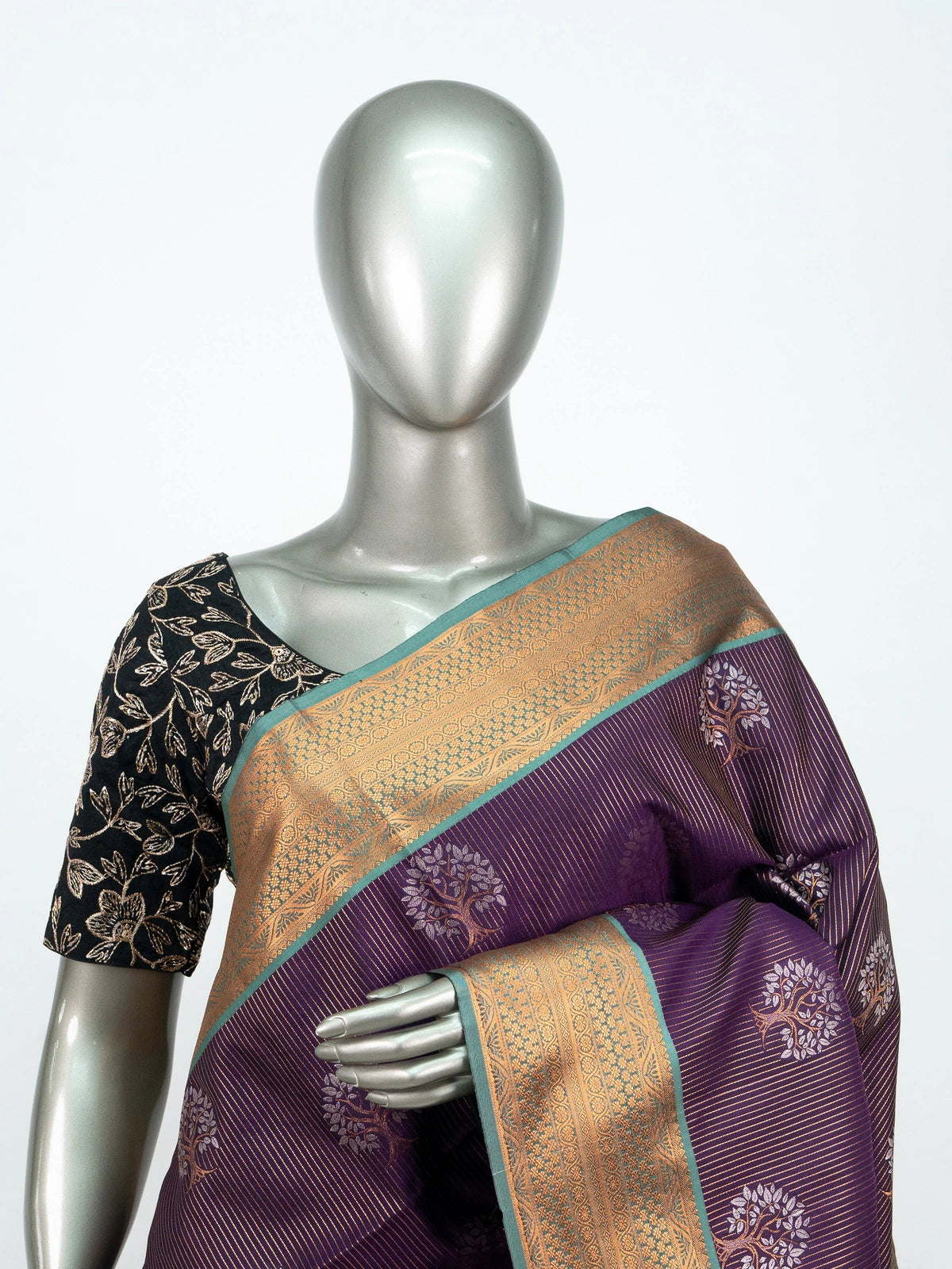 Purple soft silk saree with gold zari tree-of-life motifs and contrast teal pallu