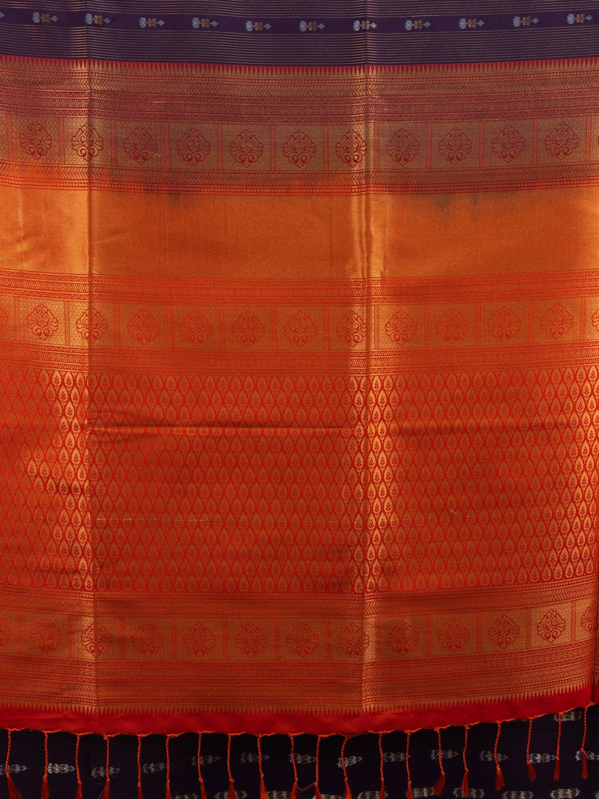 Purple Kanchipuram fancy silk saree with contrast orange gold zari border and brocade pallu