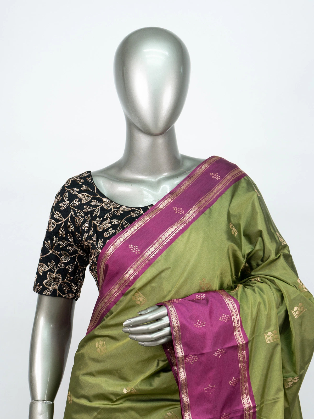 Mehndi green semi silk saree with magenta contrast border, gold zari buttas and woven pallu