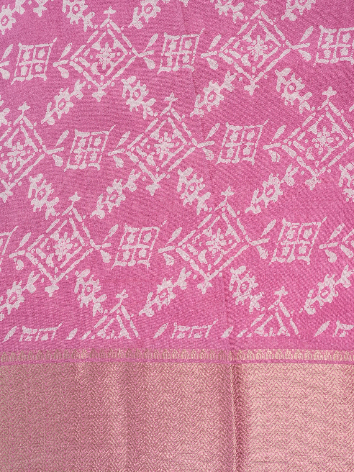Pink and white batik print cotton designer saree with gold zari border