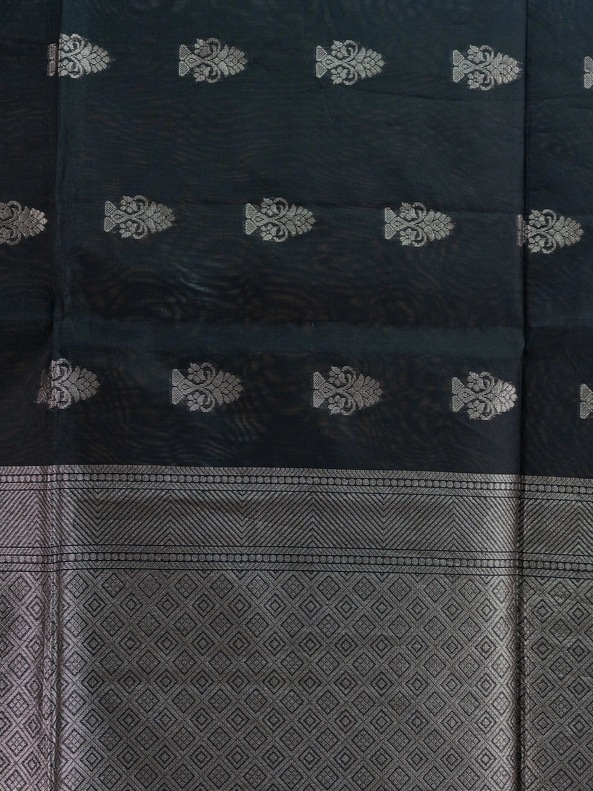 Black silk cotton saree with silver zari floral buttas and diamond-woven contrast pallu and border