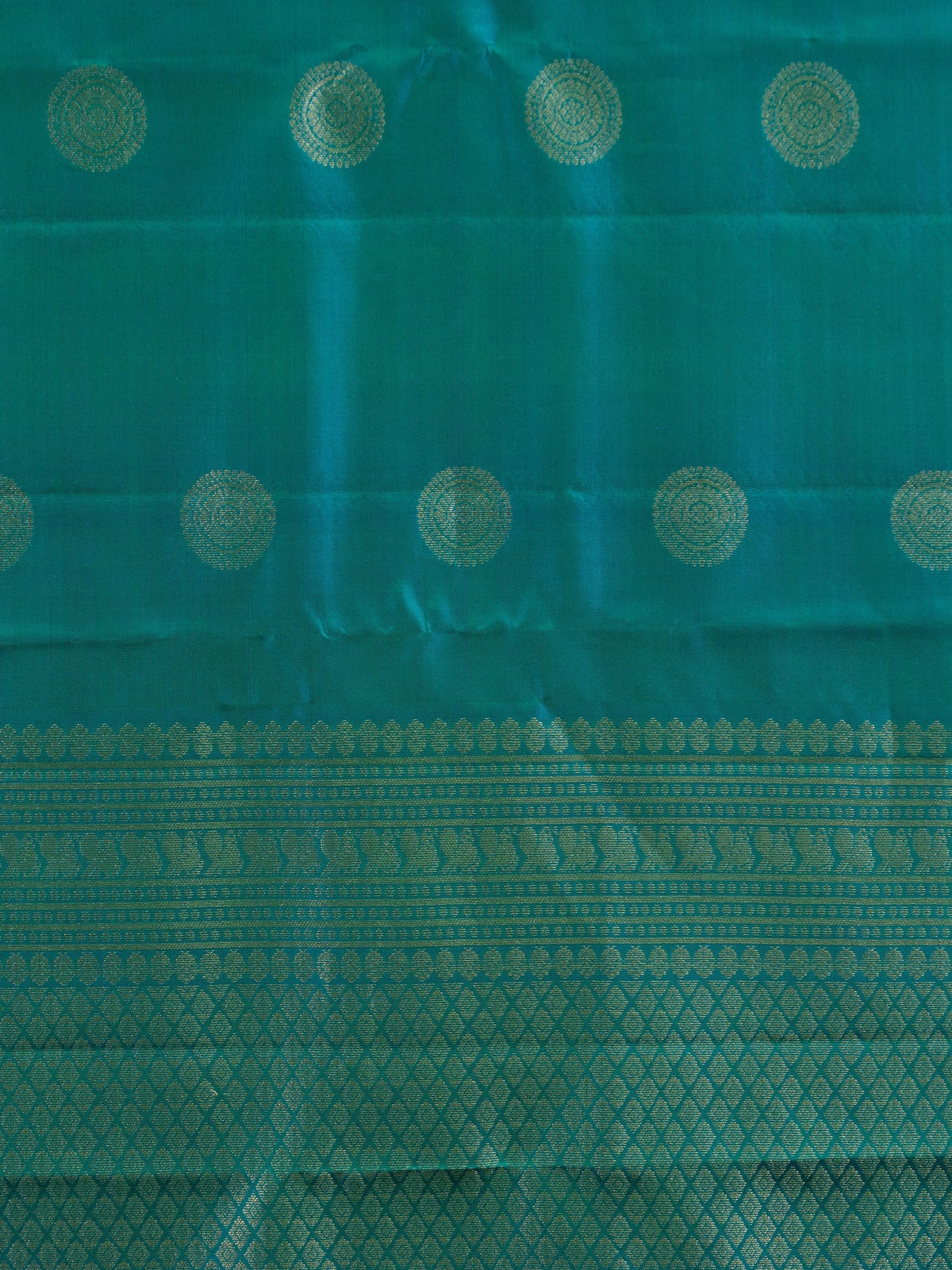 Peacock teal pure Kanchipuram silk saree with gold zari chakra buttas and contrast zari border