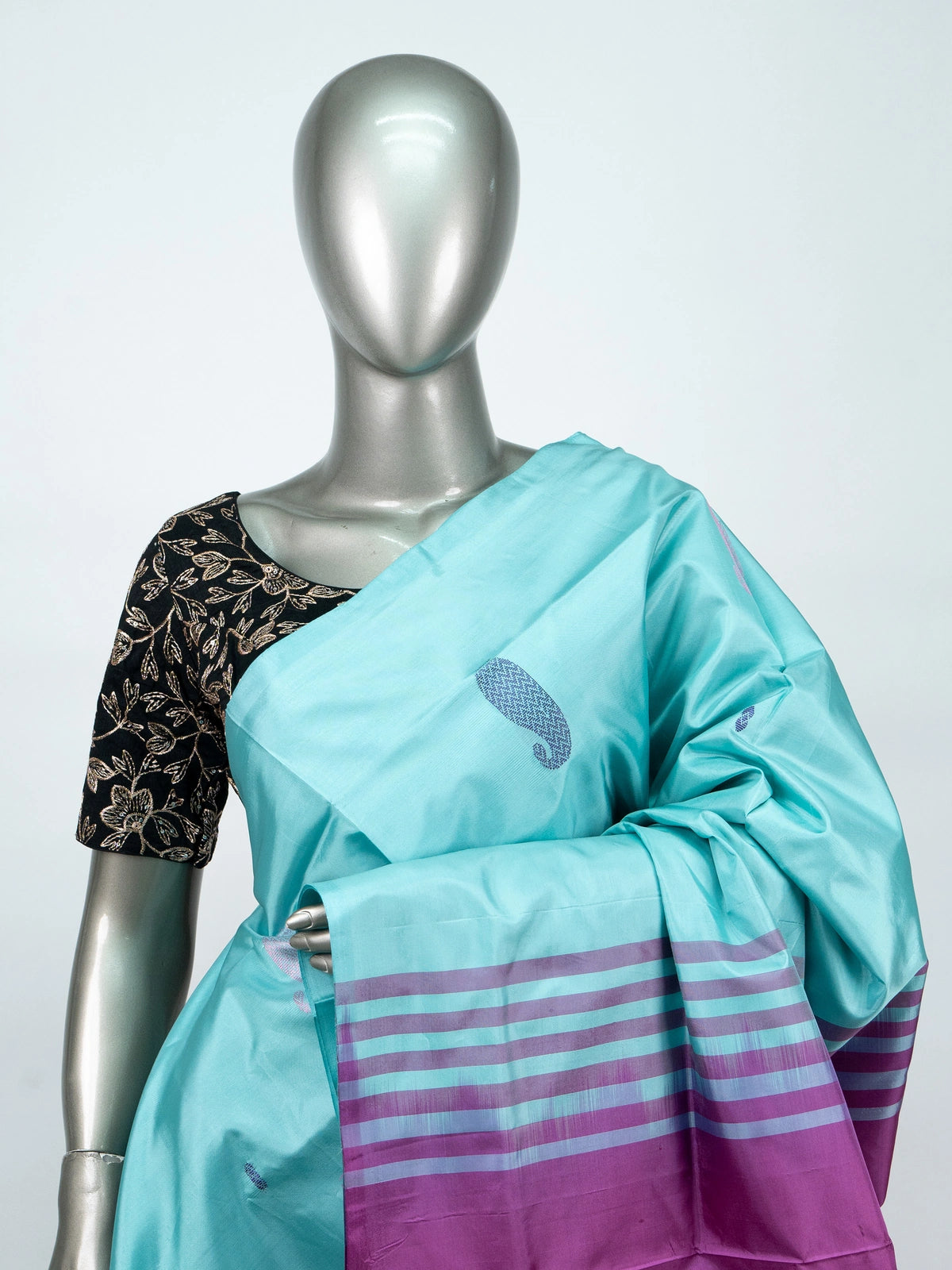 Turquoise blue Banana silk saree with contrast magenta pallu, striped border and paisley buttas