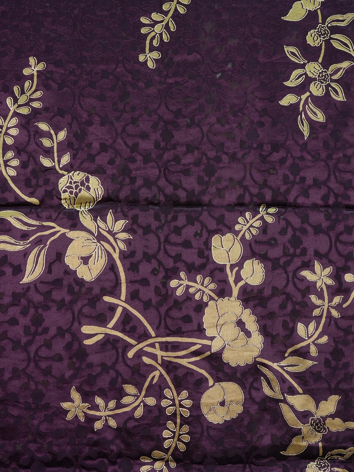 Purple and gold designer art silk saree with floral zari motifs, lotus pallu and contrast printed blouse