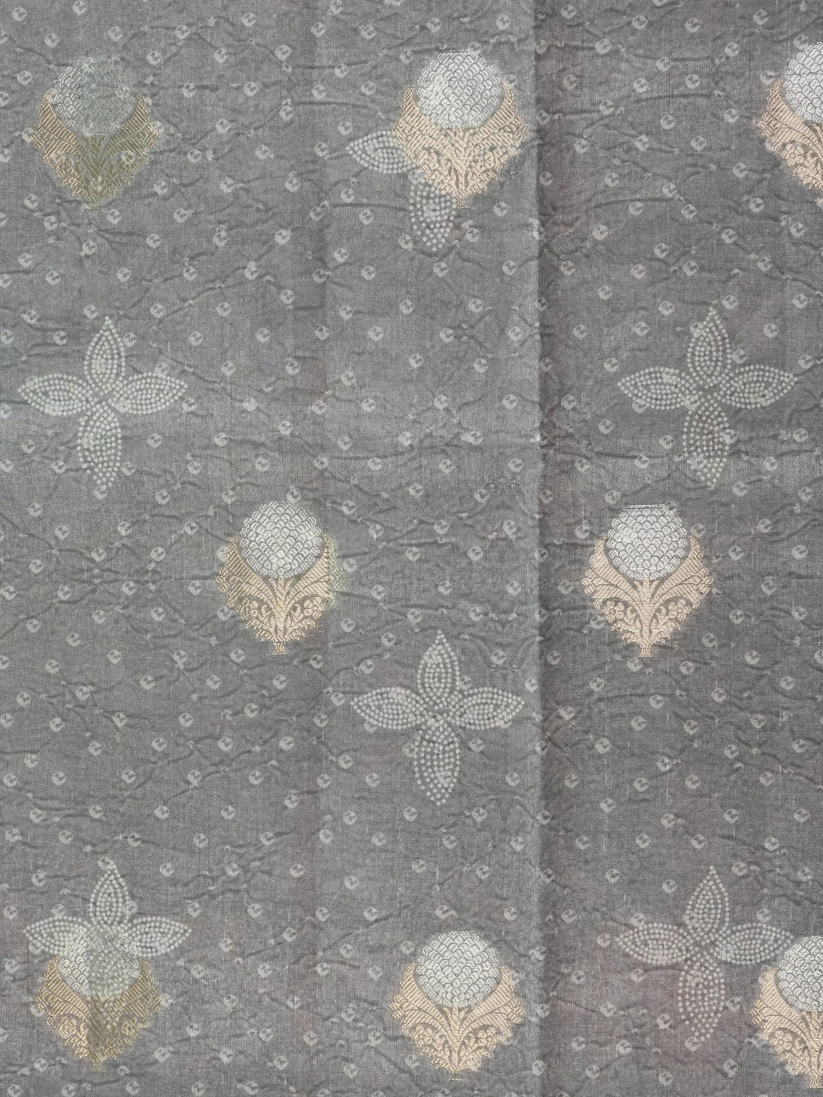 Grey designer saree with gold and silver woven floral buttas and a golden zari tissue border