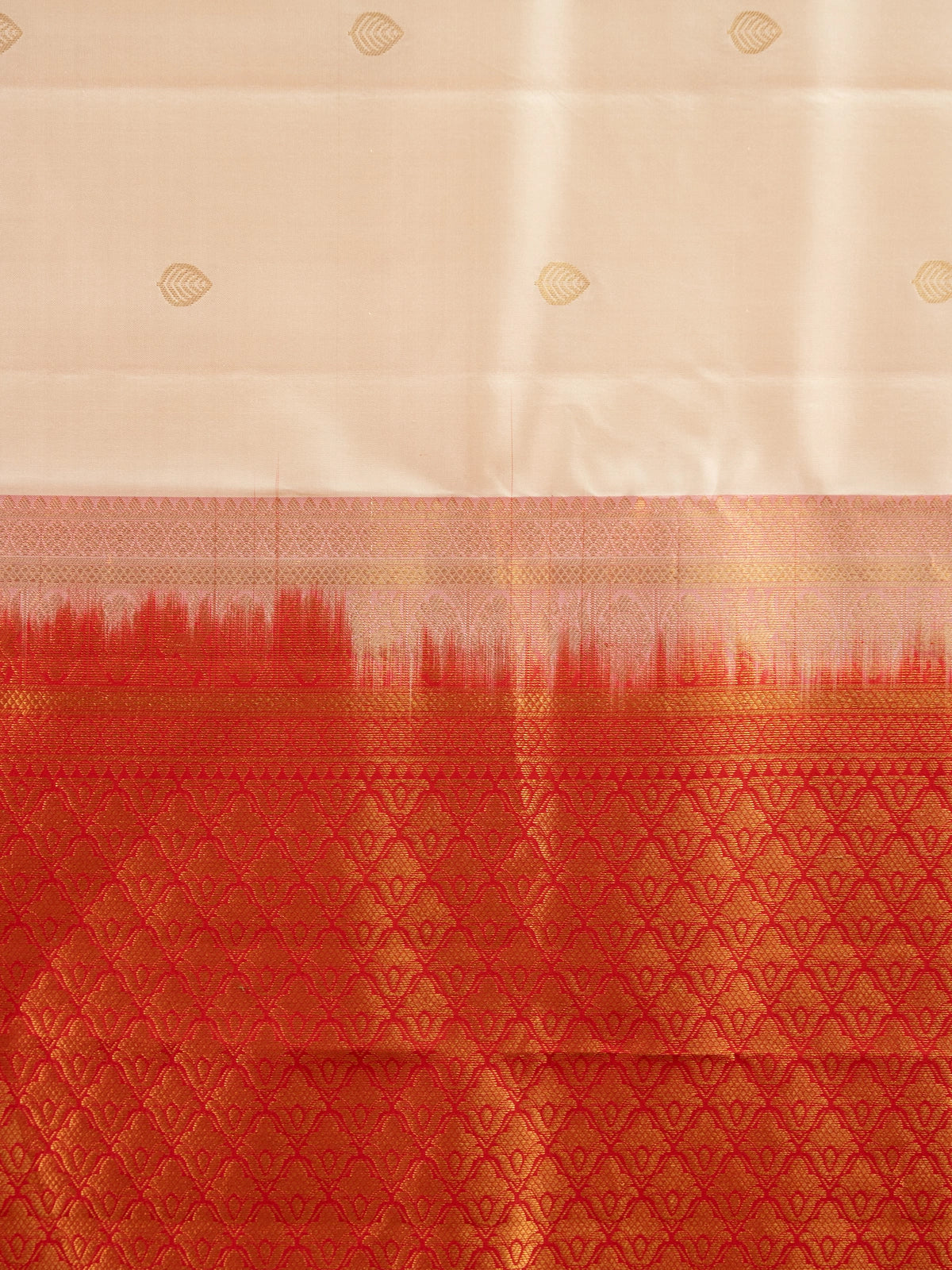 Cream pure Kanchipuram silk saree with contrast red gold zari border and pallu