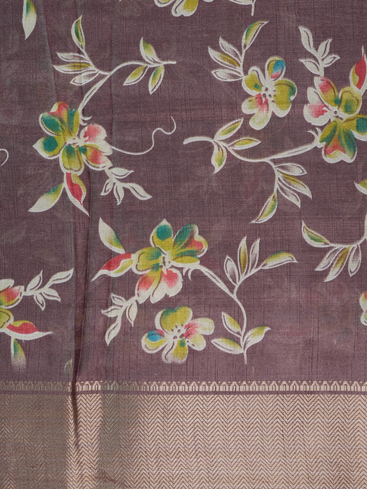 Mauve Dola silk saree with multicoloured floral print, gold zari border and yellow contrast blouse