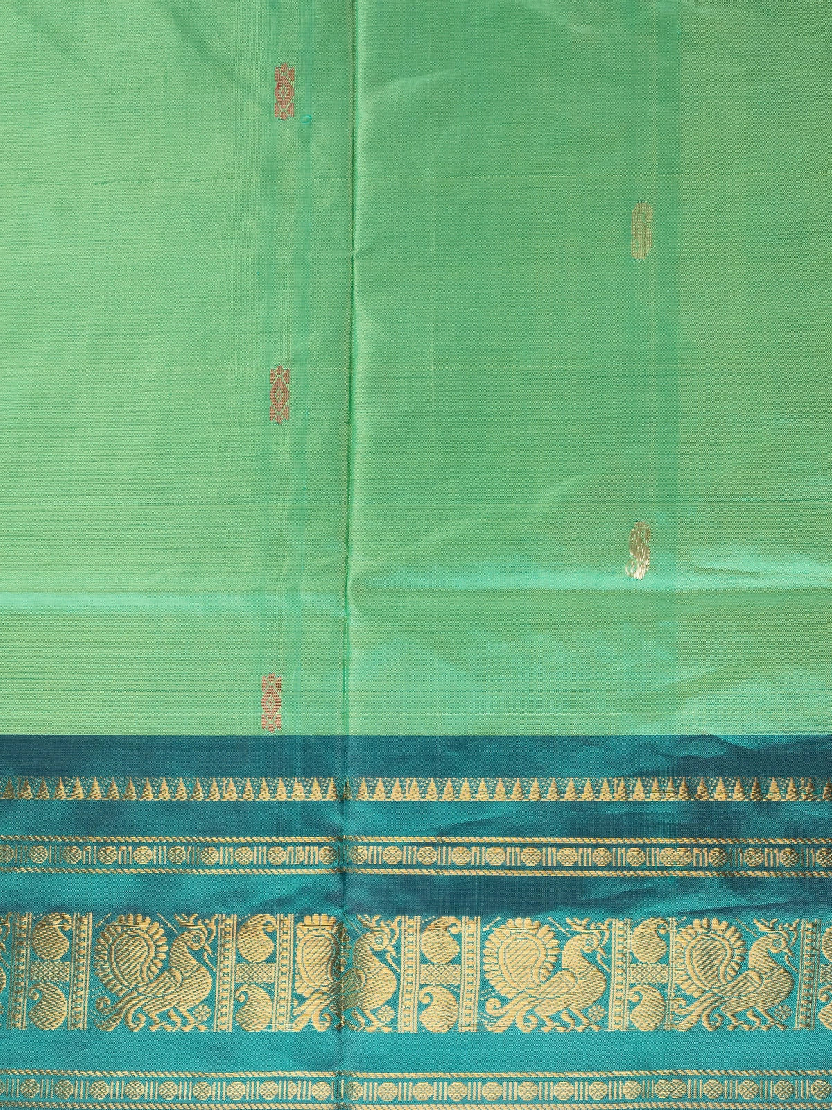 Green and black Banana Silk saree with gold zari peacock border and contrast pallu