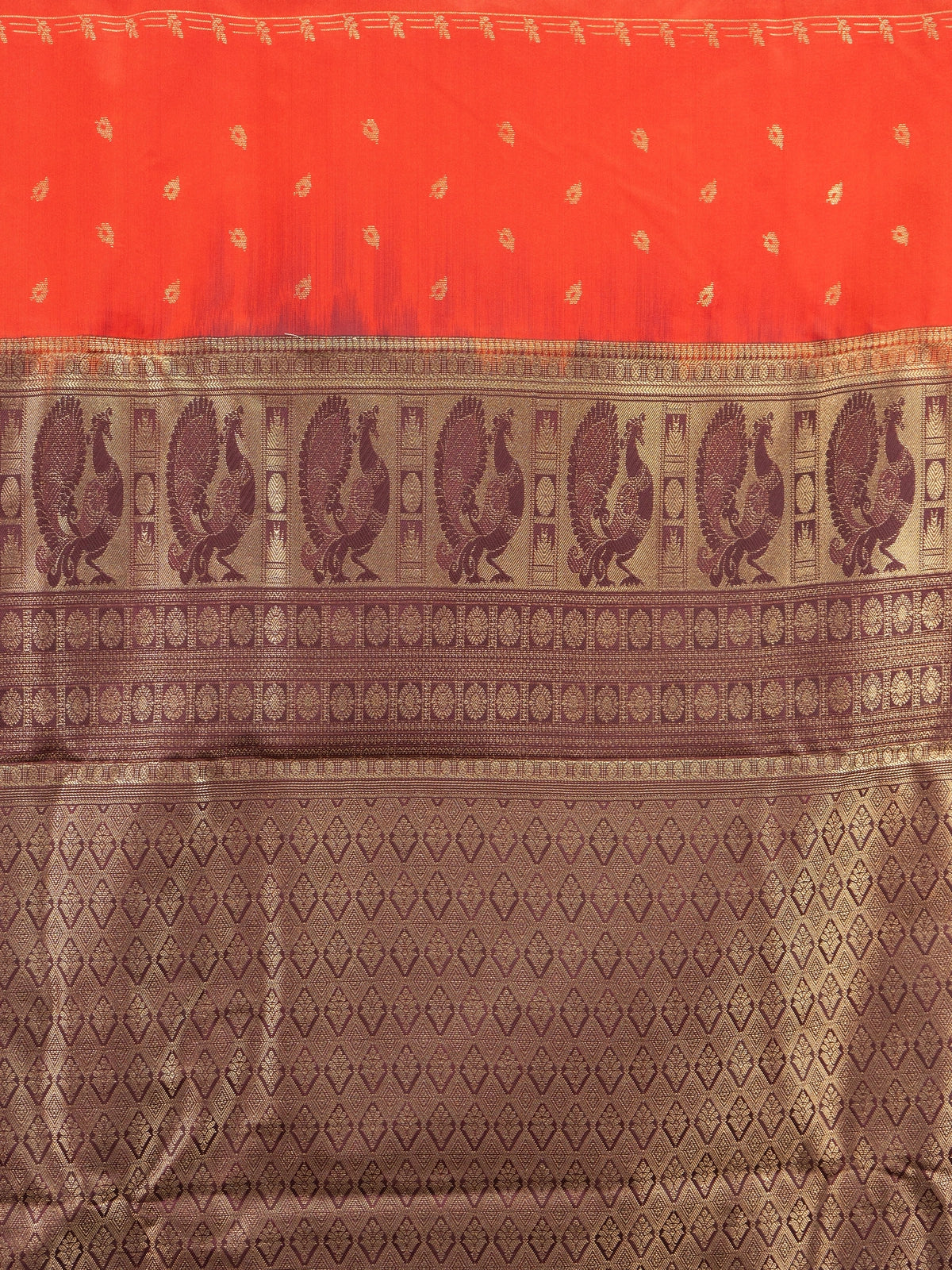 Orange semi silk saree with maroon contrast border and gold zari peacock pallu