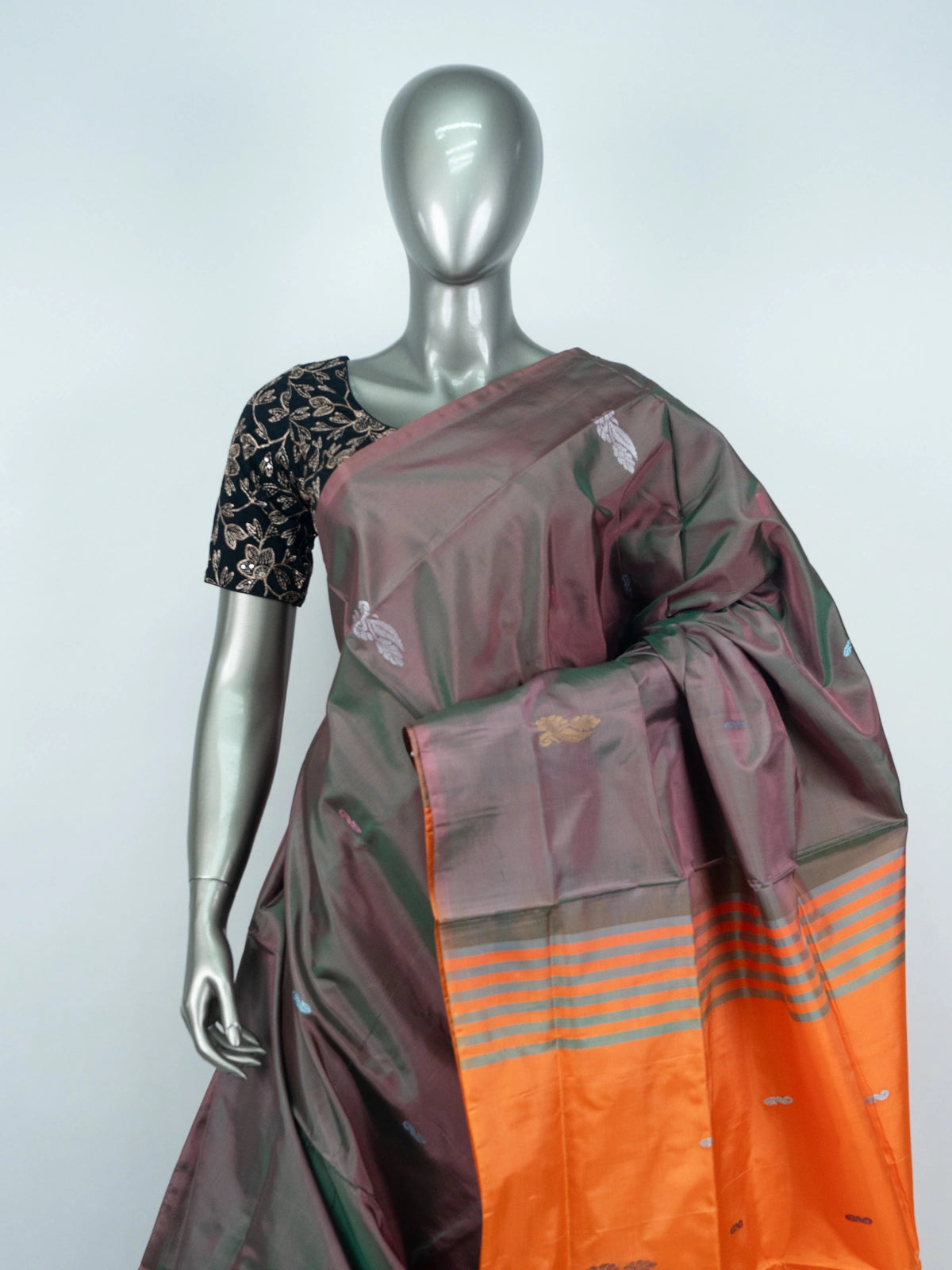 Grey and orange banana silk saree with dual-tone body, zari buttas and a striped contrast orange pallu