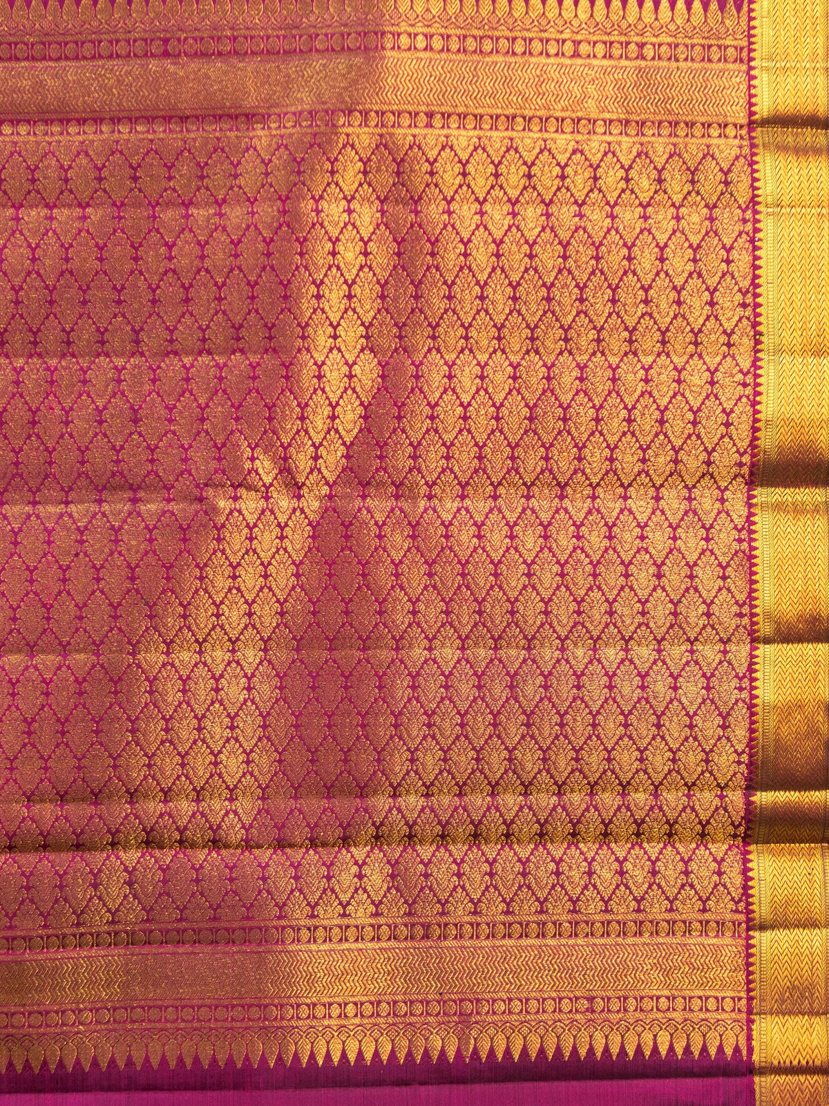 Bottle green pure Kanchipuram silk saree with magenta and gold zari contrast border and zari brocade pallu