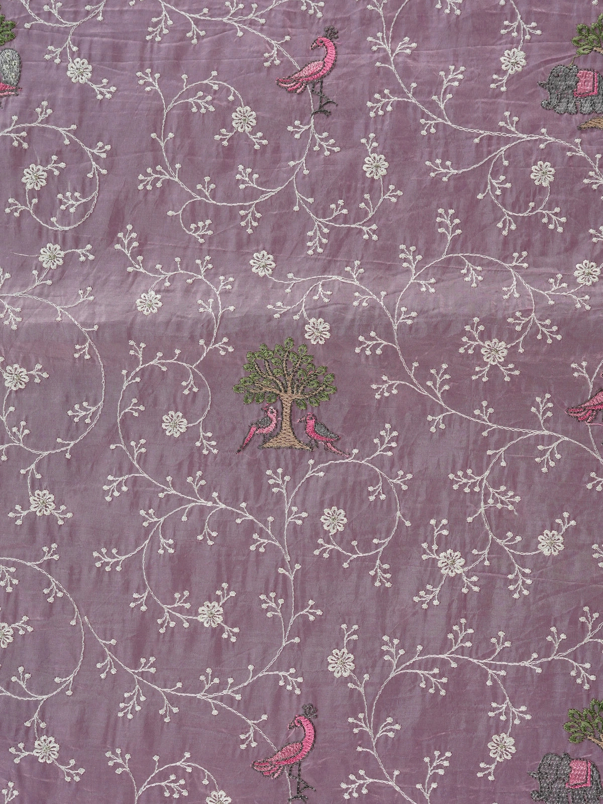 Lavender designer saree with white floral embroidery, bird and elephant motifs and pom-pom lace border