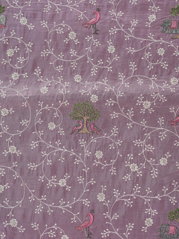 Lavender designer saree with white floral embroidery, bird and elephant motifs and pom-pom lace border