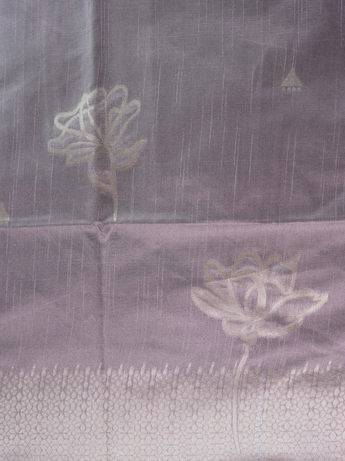 Dusty mauve semi tussar saree with silver zari floral pallu and geometric border