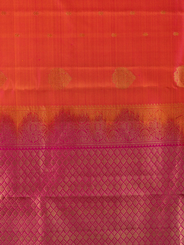Orange pure Kanchipuram silk saree with contrast pink zari border and gold buttas
