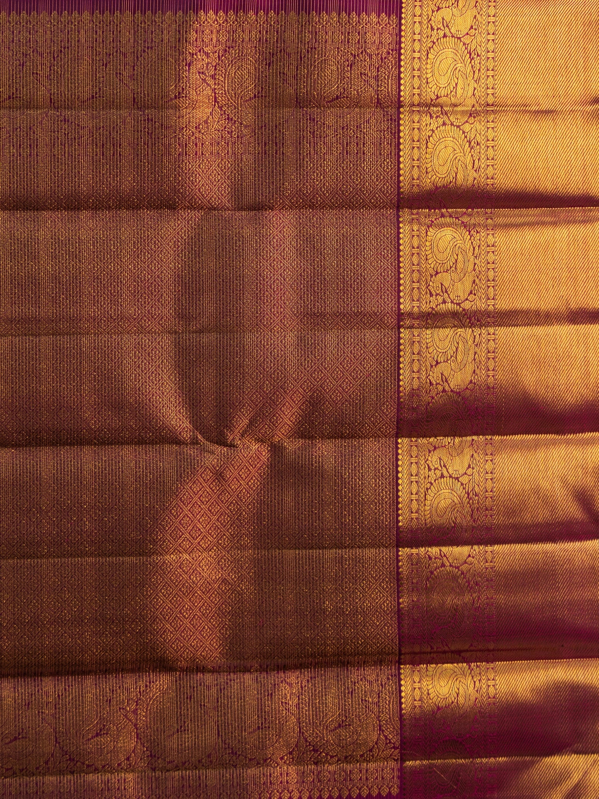 Magenta pure Kanchipuram silk saree with gold zari checks and contrast peacock-motif border
