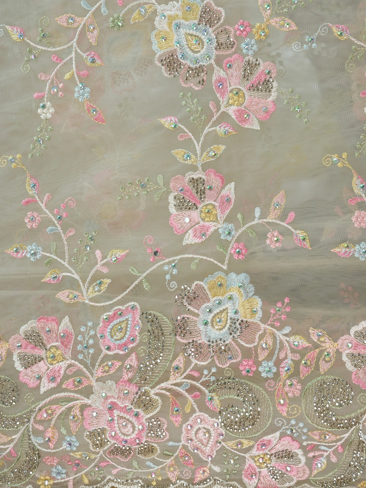 Cream net designer saree with pastel multicolour floral embroidery and scalloped border