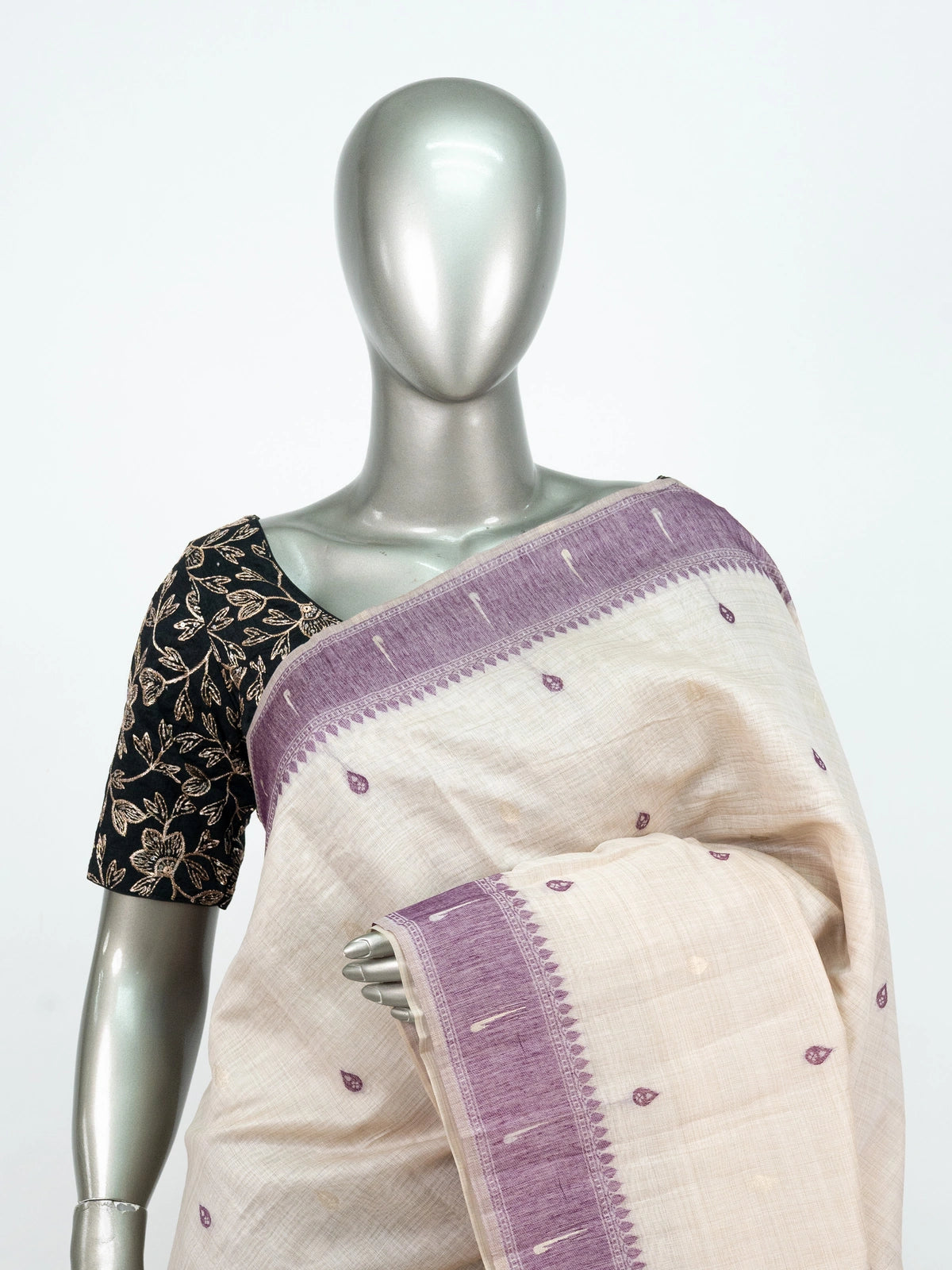 Cream linen cotton saree with lavender contrast border and multicoloured peacock pallu