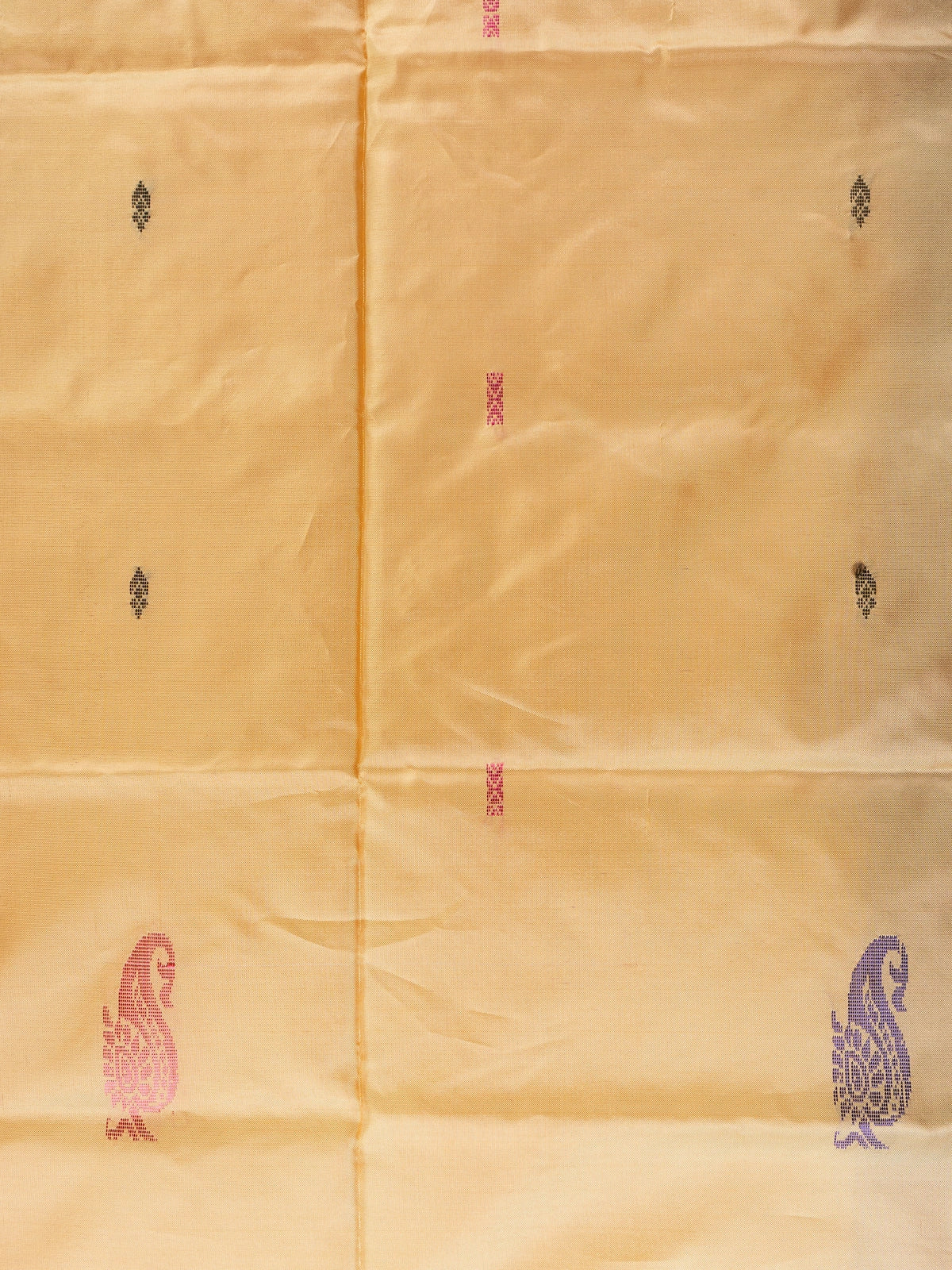 Golden yellow banana silk saree with plum contrast pallu, zari stripes and paisley buttas