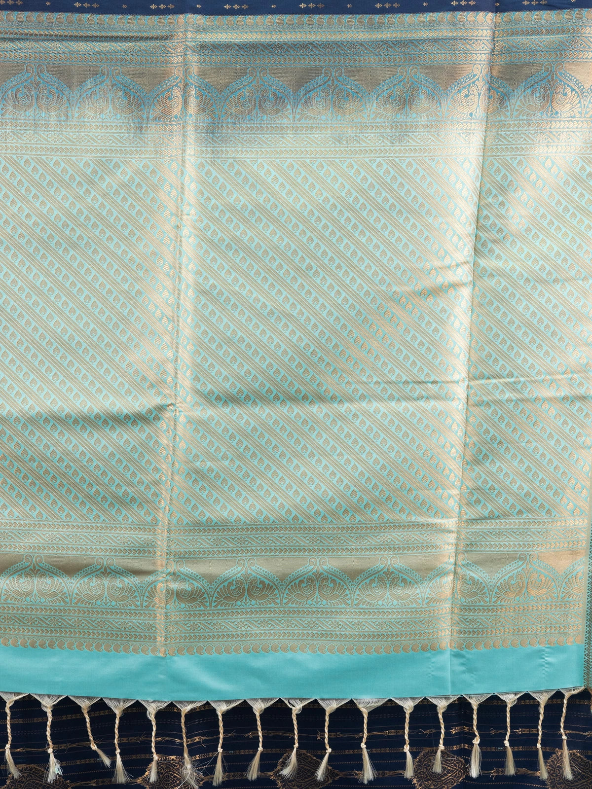 Navy blue Kanchipuram fancy silk saree with sea-green contrast zari border and gold zari motifs