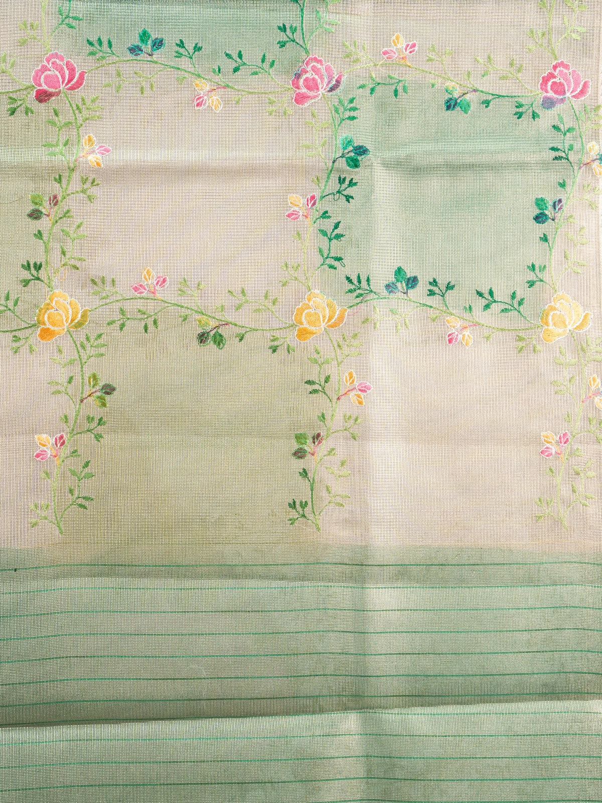 Cream and green semi raw silk saree with multicoloured floral vines and a green zari border