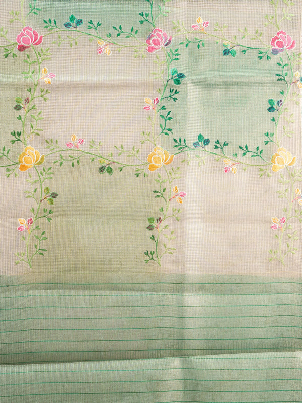 Cream and green semi raw silk saree with multicoloured floral vines and a green zari border