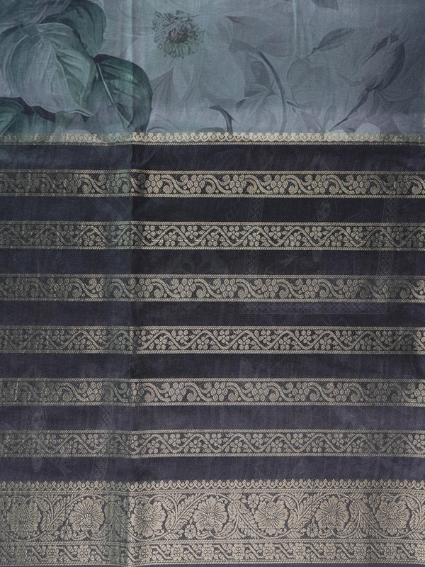 Charcoal grey semi tussar saree with gold zari stripes, floral prints, and a woven gold border