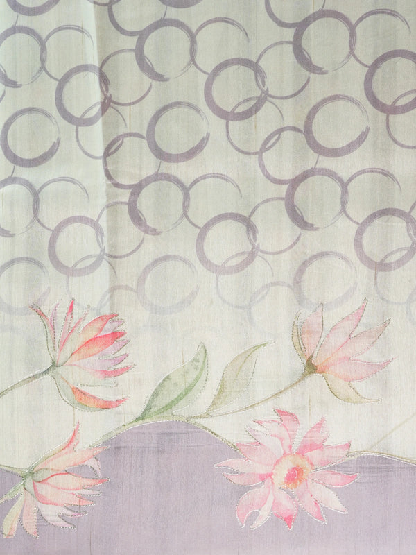 Cream and lavender designer silk saree with hand-painted lotus florals and silver thread work