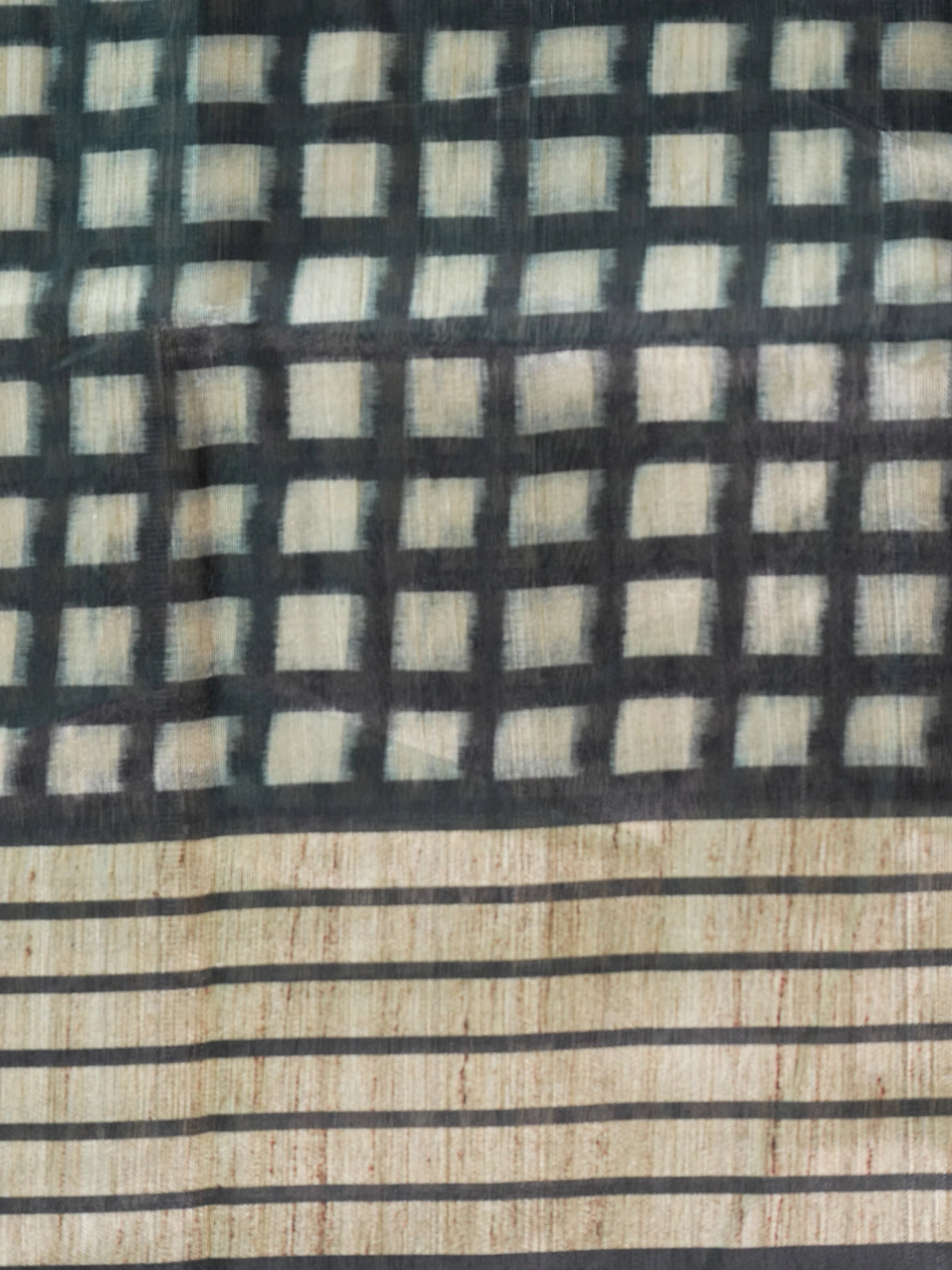 Beige and black checked semi tussar saree with black border and Kalamkari-style bird and floral pallu