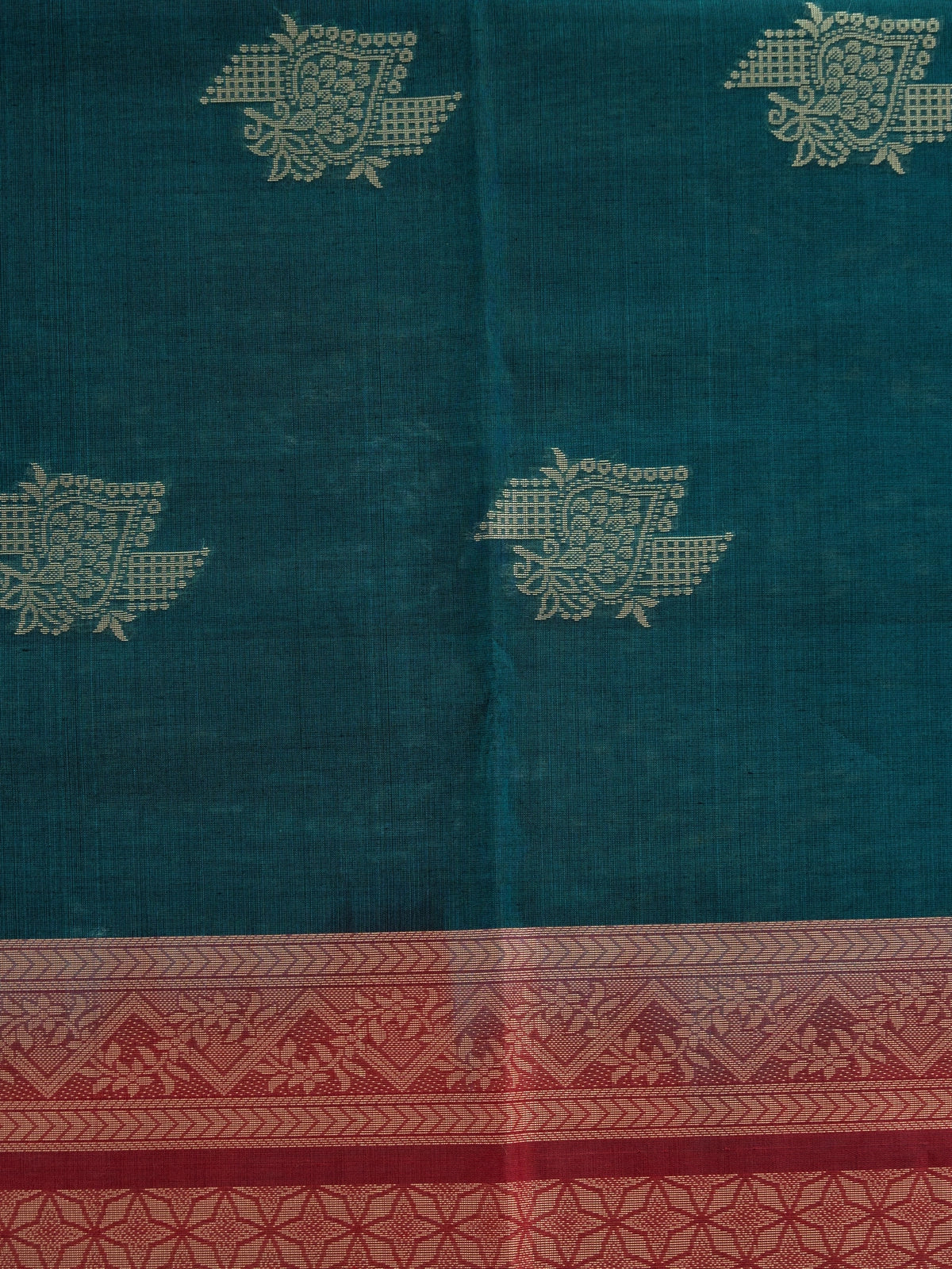 Teal green pure silk cotton saree with contrast maroon border, woven butta motifs, and geometric maroon pallu