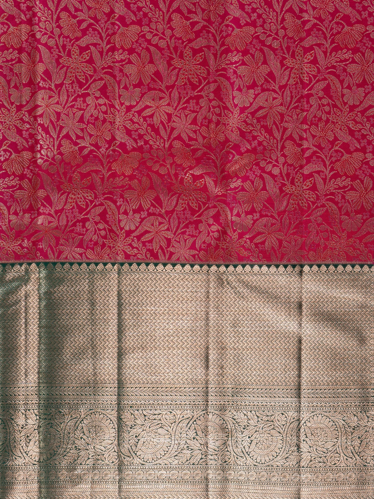Rani pink pure Kanchipuram silk saree with green contrast border and gold zari floral jaal