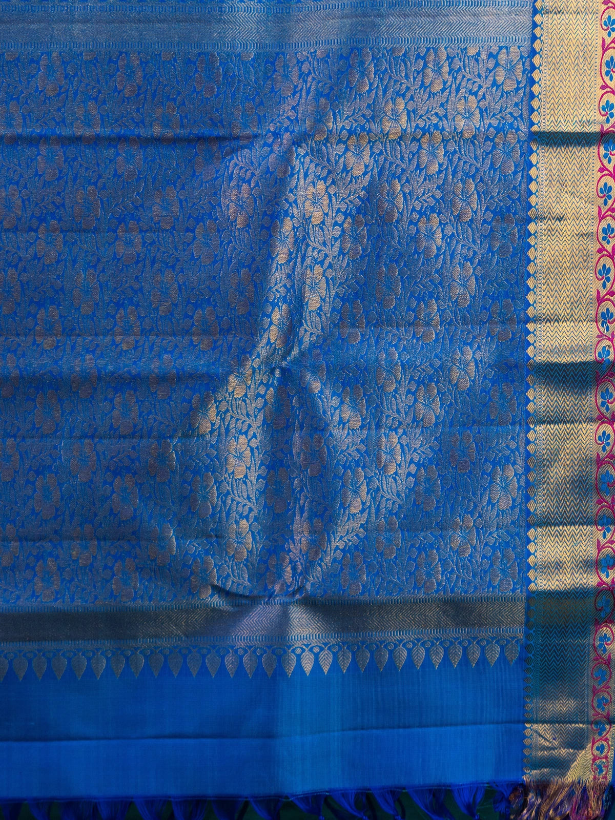 Teal green pure Kanchipuram silk saree with contrast blue and gold zari border and floral zari pallu