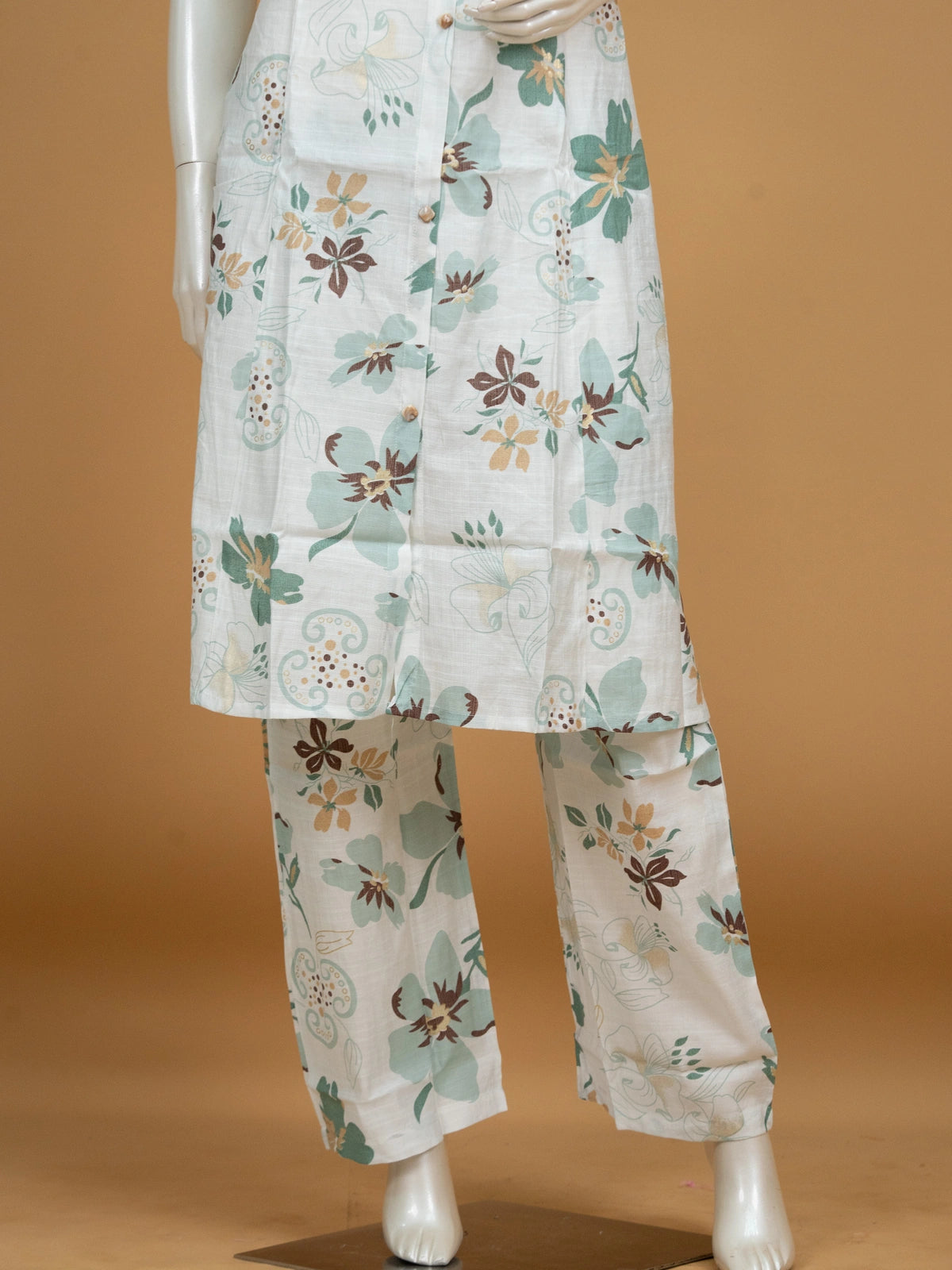 White floral printed cotton co-ord set with sleeveless collared kurti and matching straight pants