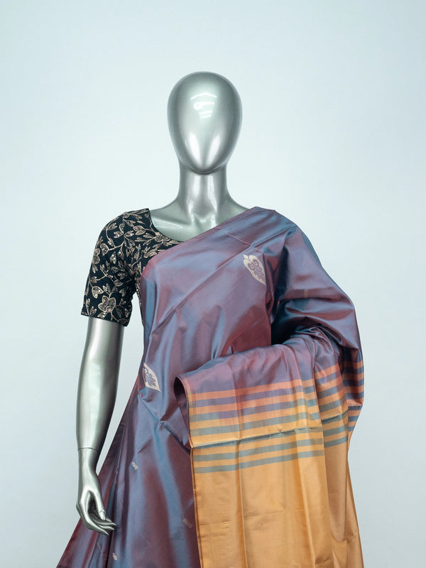 Mauve-grey dual-tone Banana Silk saree with gold zari butis and a contrast mustard pallu