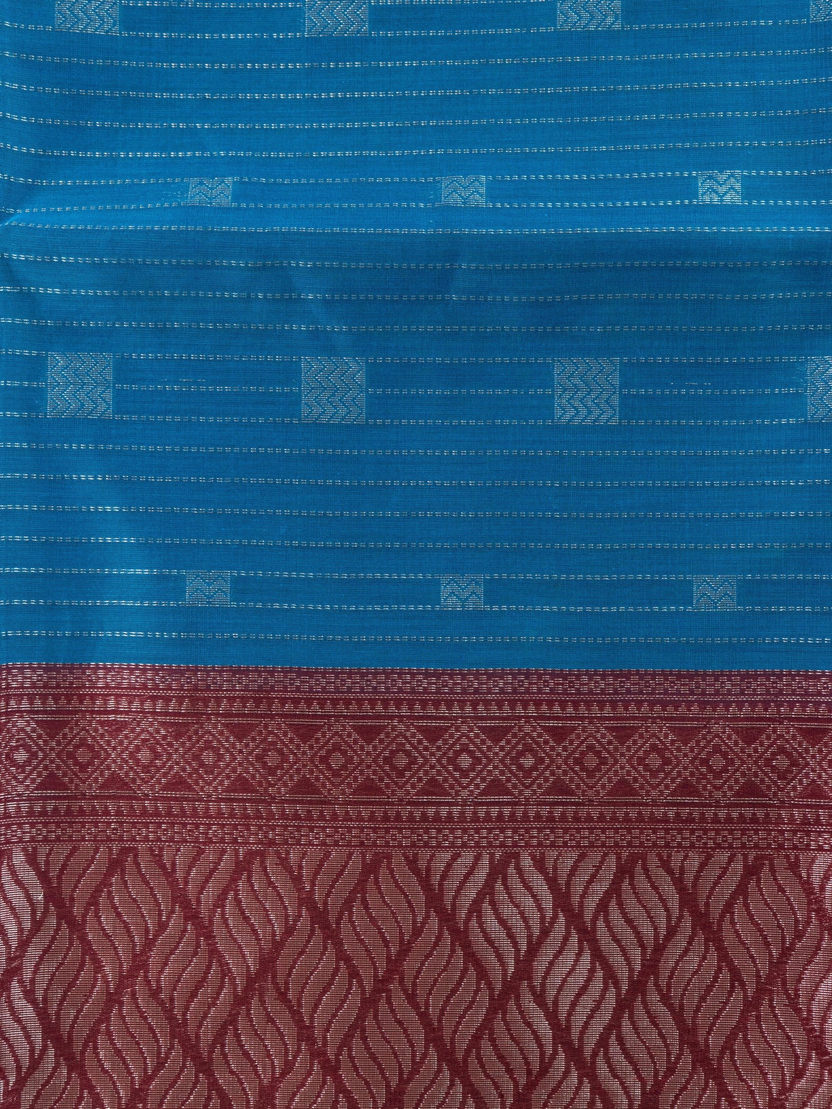 Peacock blue silk cotton saree with silver stripes, square buttas and contrast maroon zari border and pallu
