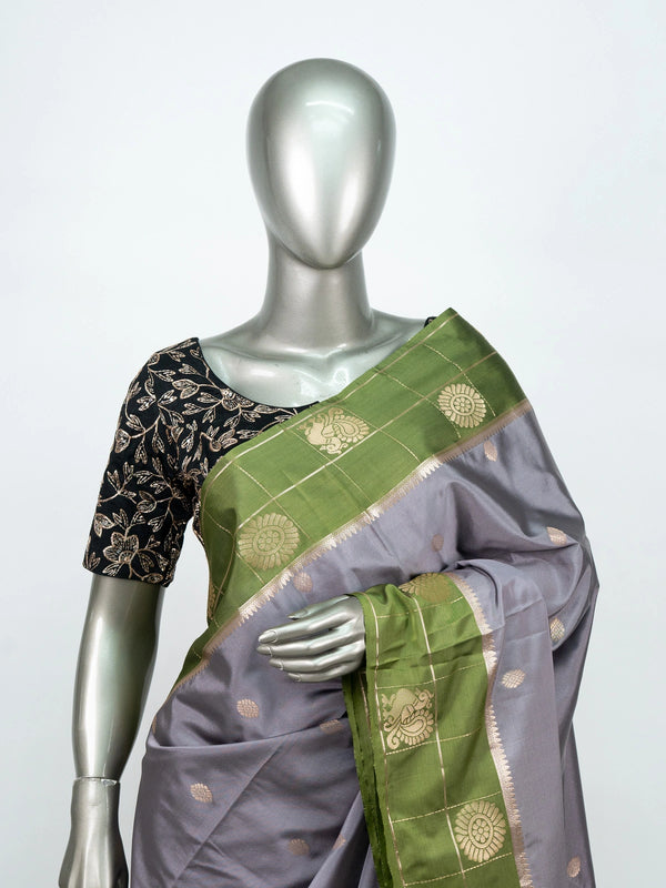 Grey semi silk saree with green contrast gold zari border and floral pallu