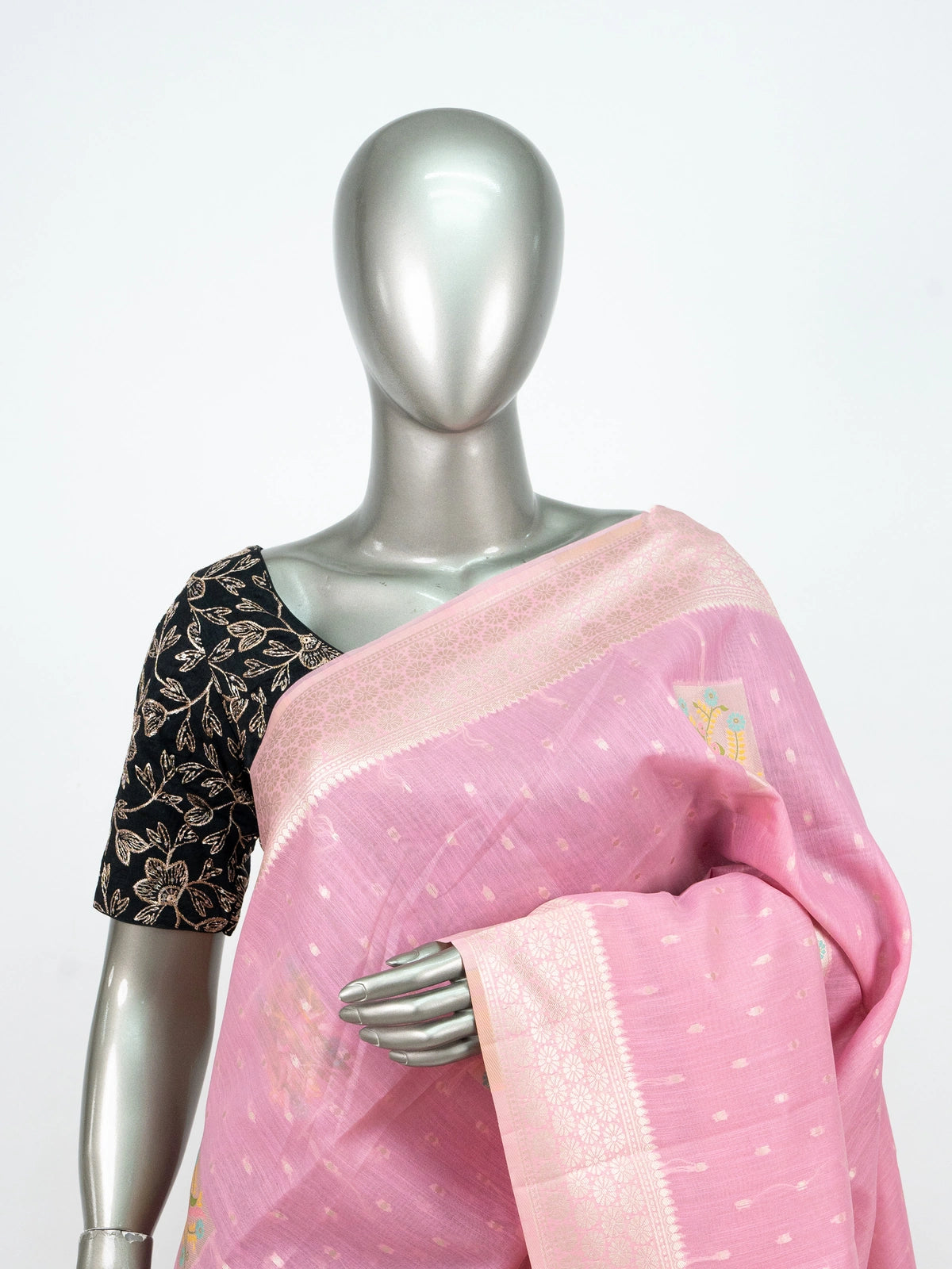 Pink linen cotton saree with silver zari border, buti weave and floral butta motifs