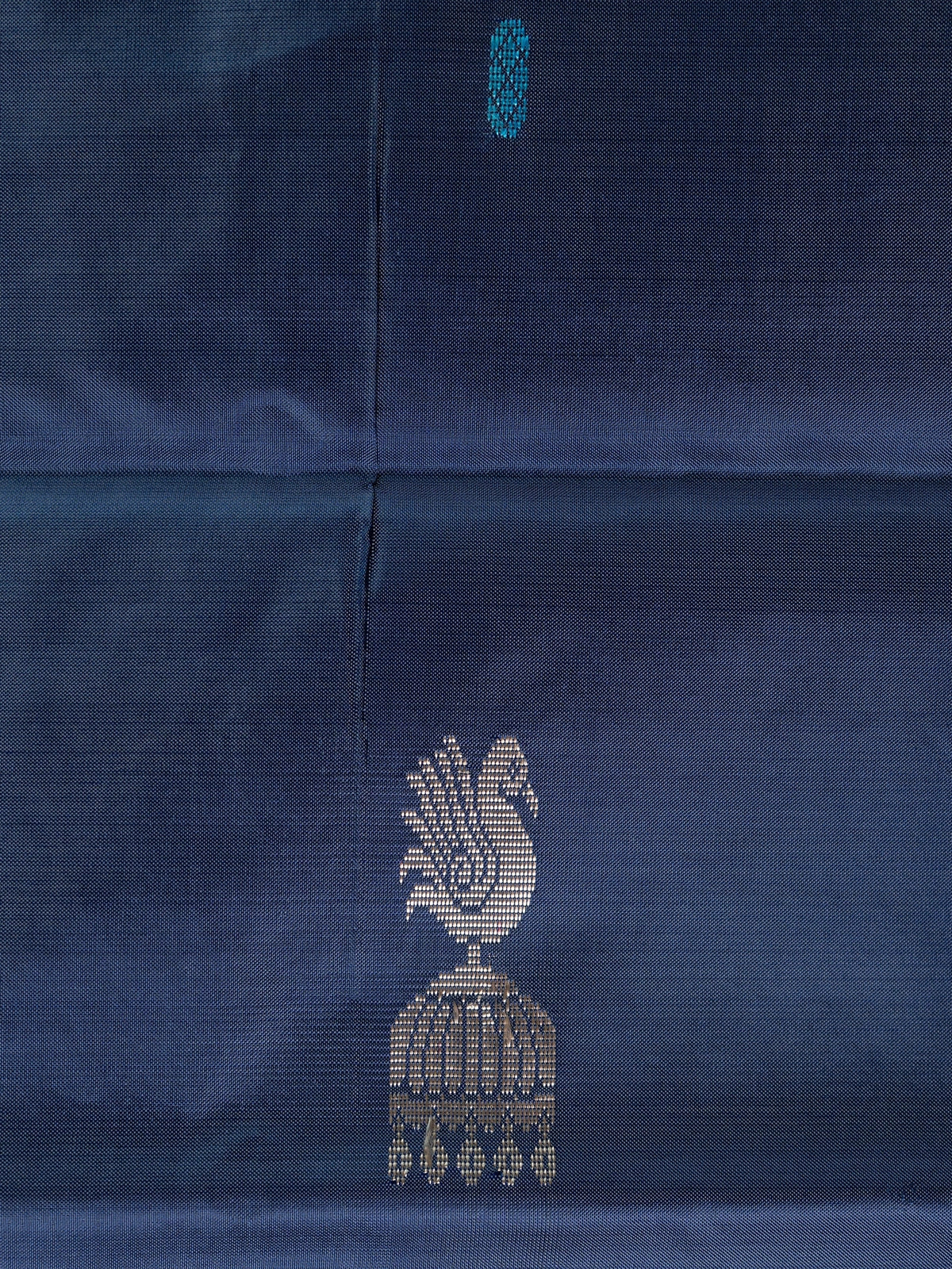 Navy blue banana silk saree with contrast peach pallu, peacock motifs and gold zari border