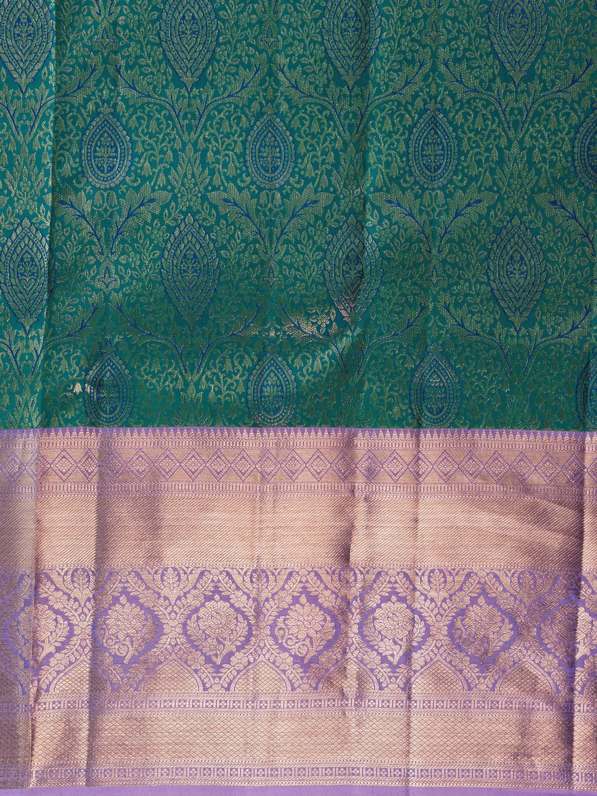 Teal green pure Kanchipuram silk saree with gold zari brocade and contrast lilac pink border and pallu