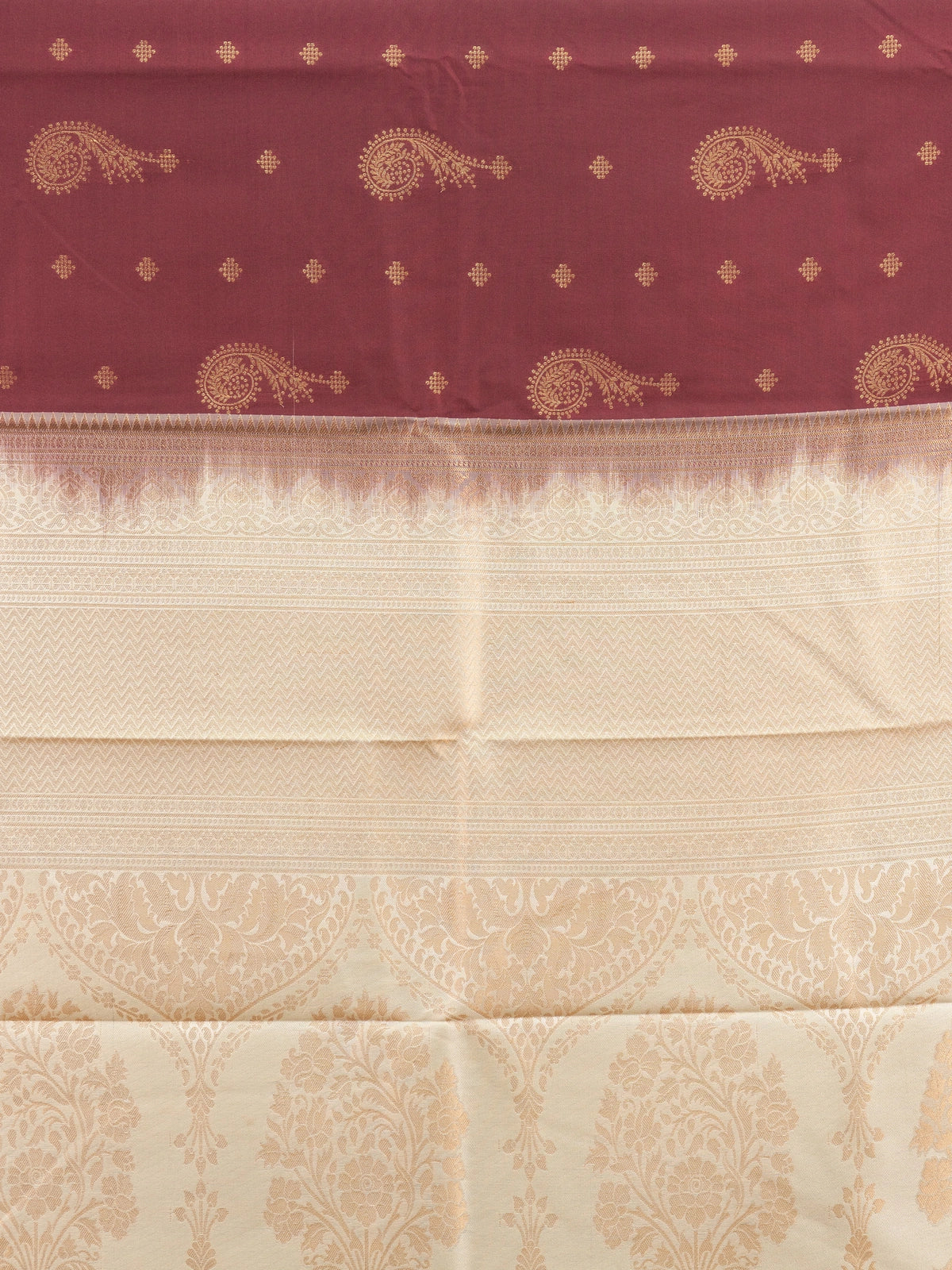Maroon semi silk saree with gold zari paisley butis and contrast cream zari border