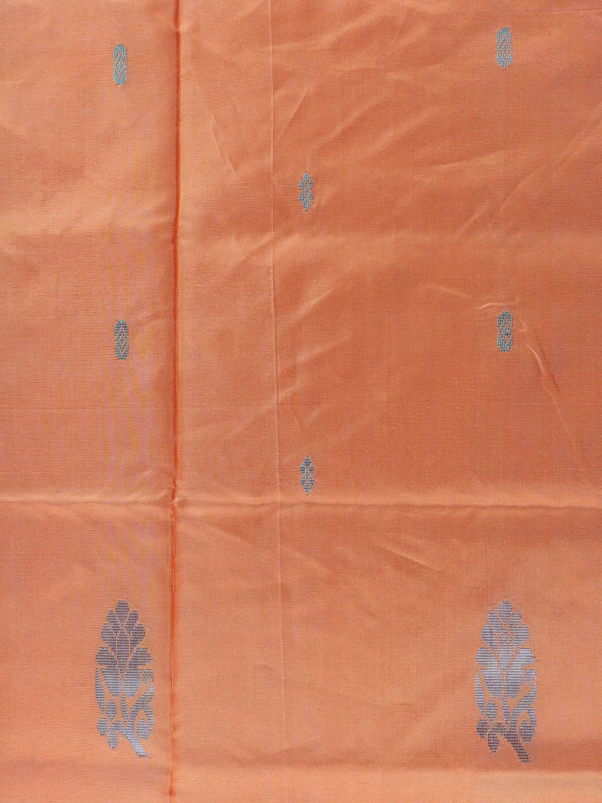 Peach orange banana silk saree with silver buttas and a contrast grey striped pallu