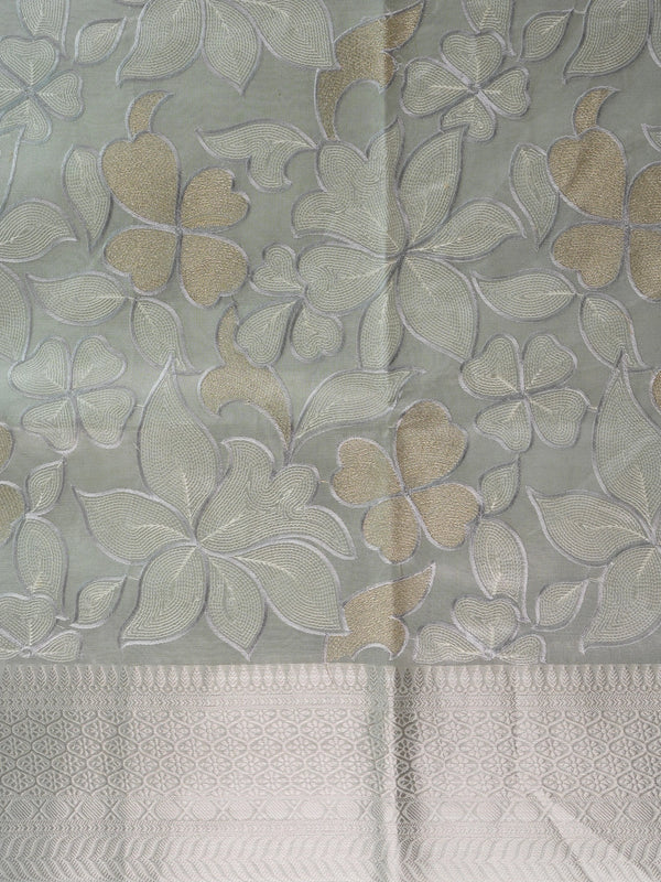 Pastel grey-green organza designer saree with floral embroidery and silver zari border